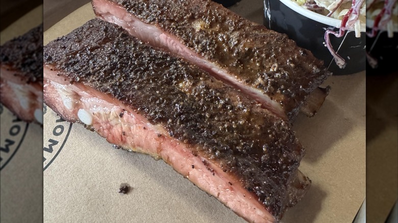 two ribs on parchment tray from hometown bbq