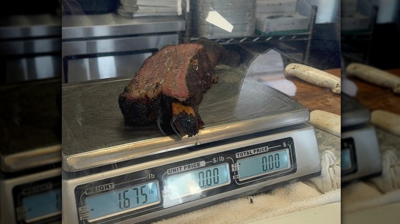 A large beef rib sits on a scale at Heritage Barbecue in San Juan Capistrano, California