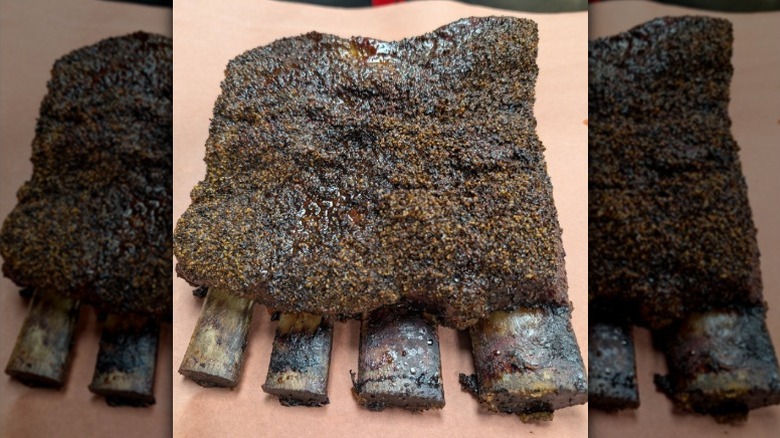 Large beef ribs lie on butcher paper at Tanker BBQ Co. in Wichita, Kansas