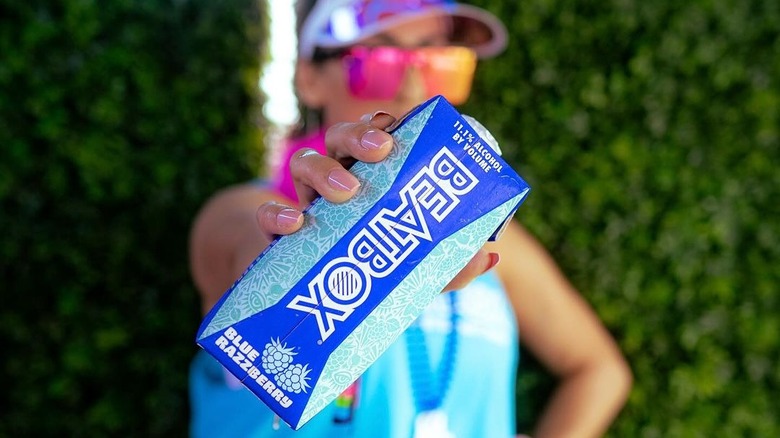 Person holding blue razzberry beatbox single serve