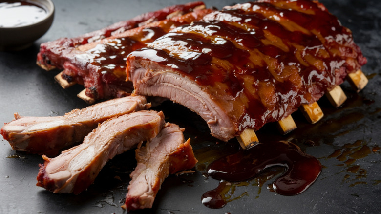 Pork or beef ribs slathered in barbecue sauce