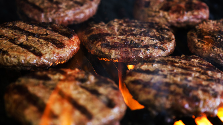 burgers cooking on grill
