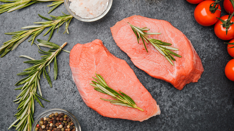 Raw veal steaks.