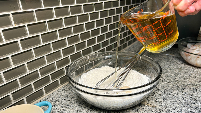 pouring beer into flour