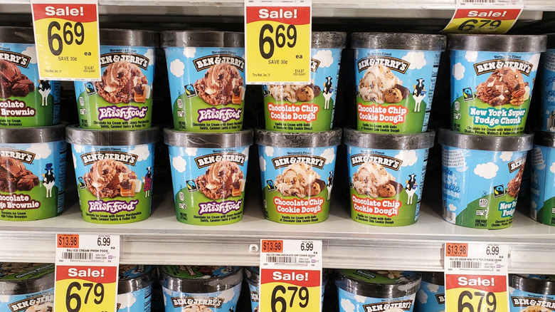 Rows of Ben & Jerry's ice cream in the freezer section of a grocery store