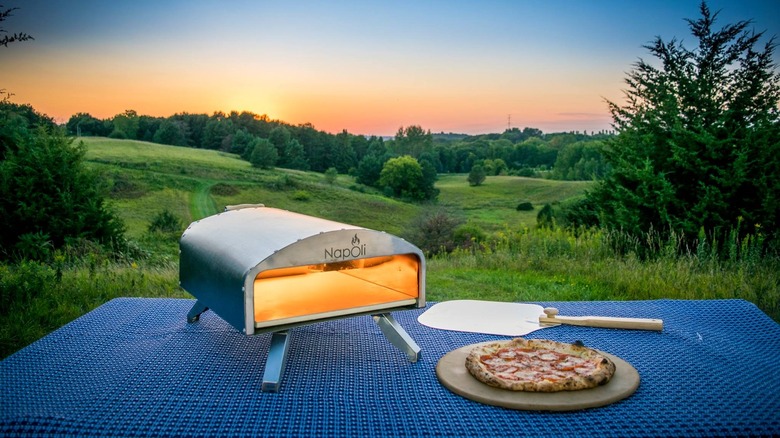 Bertello outdoor pizza oven with sunset