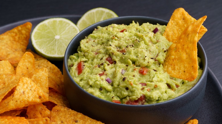 Guacamole in a bowl with chips