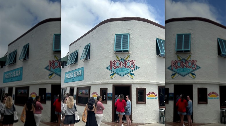 Exterior of Kono's Cafe with a line out the door.