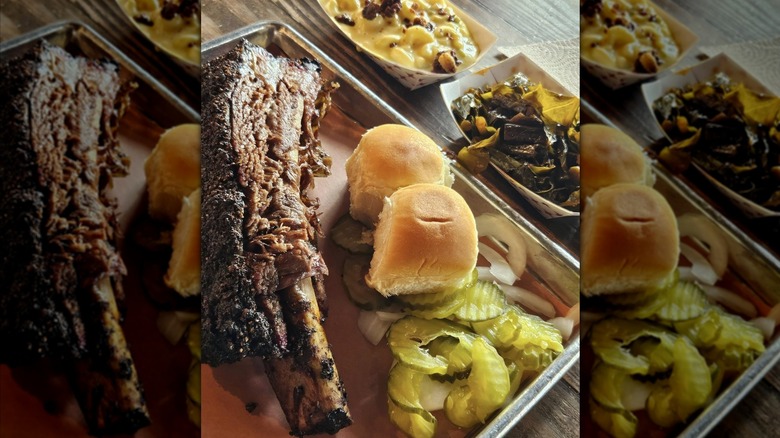 Barbecue tray with meats, pickles, and sides from Pecan Lodge.