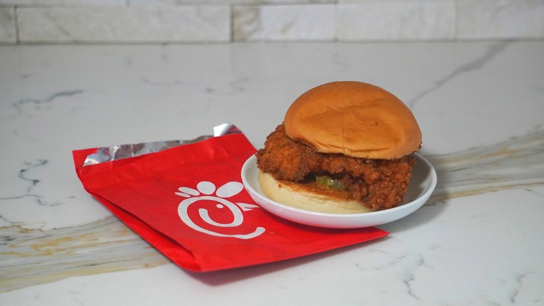 Chick-fil-a sandwich on a plate.
