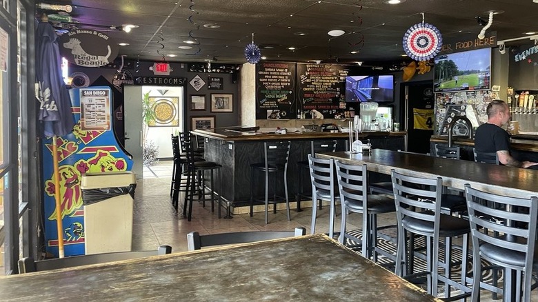 Interior of the Regal Beagle gastropub, showing bar stools, games, and casual vibe.