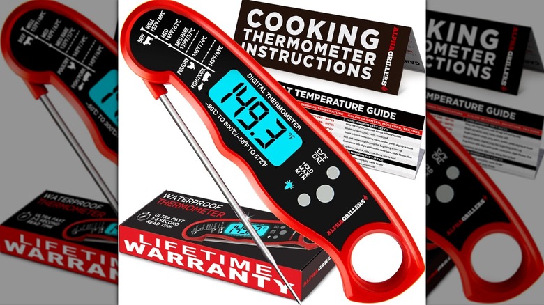 A meat thermometer and its packaging sits against a white background.