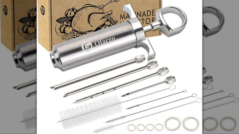A meat injector kit sits against a white background.