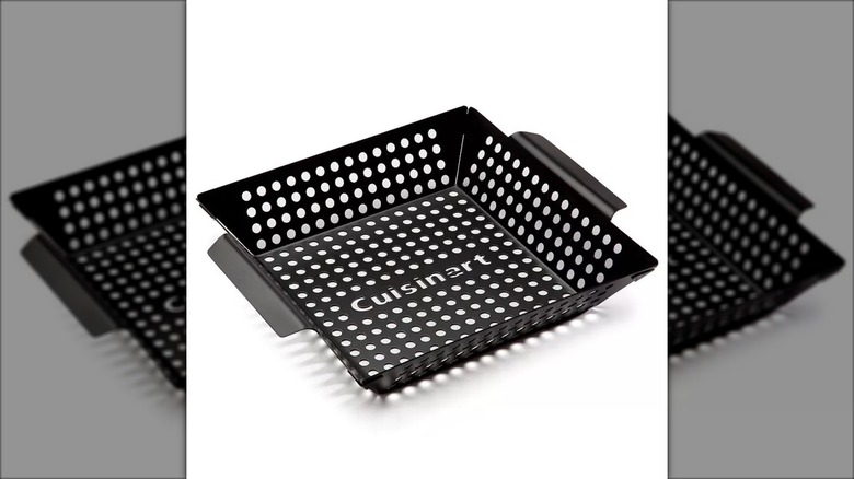 A grill basket sits against a white background.