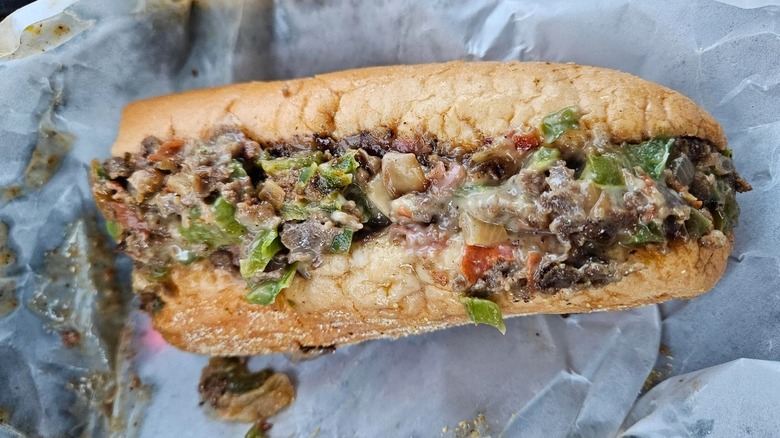 Market Basket Steak Bomb sitting on sandwich wrapping paper in a car