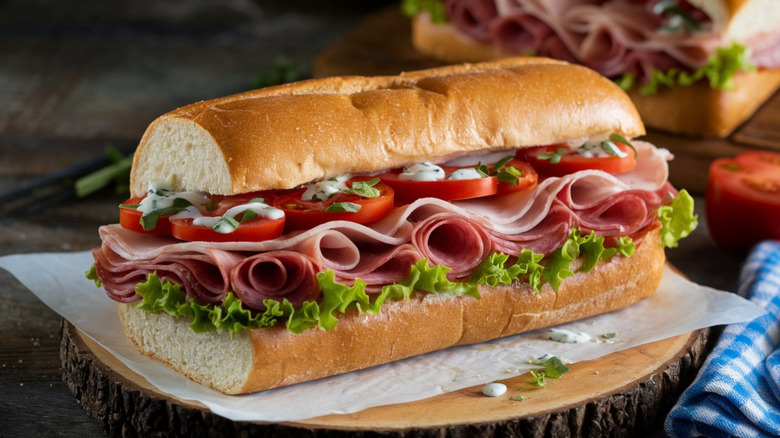 Deli meat sub with turkey, salami, tomato, and lettuce