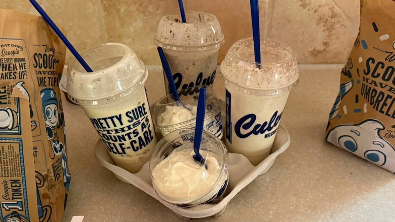 Three Culver's concrete mixers sit in a beverage carrier.