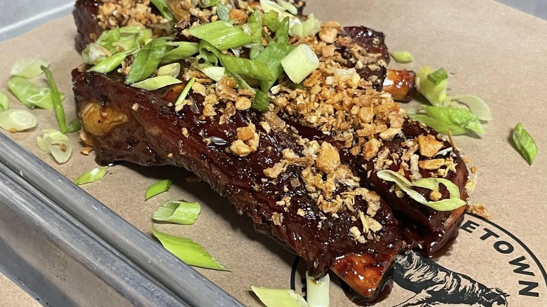 Korean barbecue ribs sit on a tray