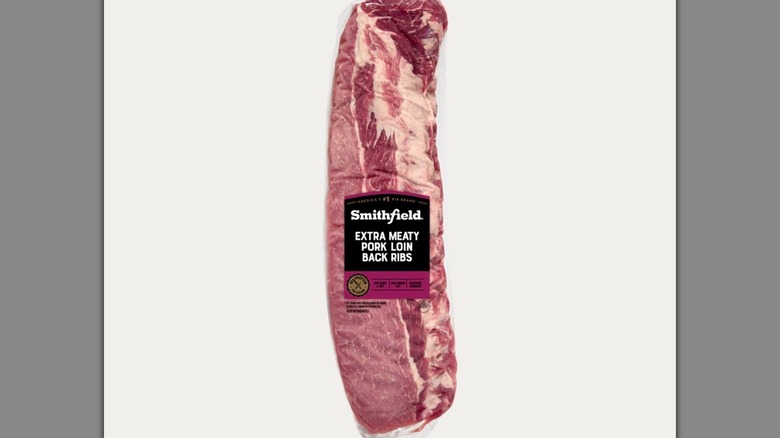 Packs of Smithfield Extra Meaty Pork Loin Back Ribs lie on a cabinet