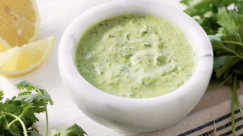 A small bowl of green goddess dressing