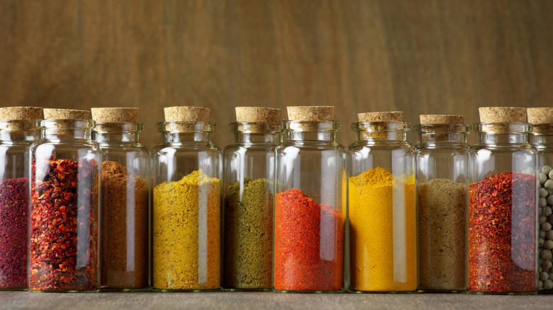 Assorted ground spices in glass jars