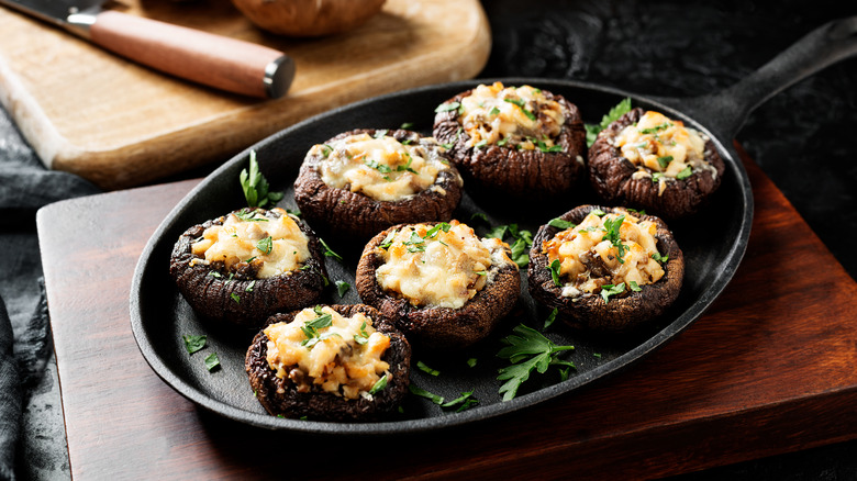 Stuffed mushroom caps in an iron skillet
