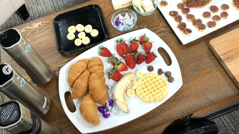 Biem sprayer near platter of breakfast foods