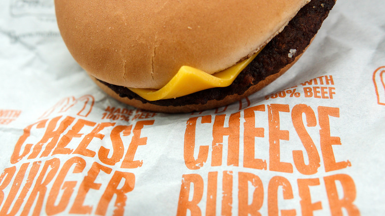 McDonald's cheeseburger on its paper wrapper.