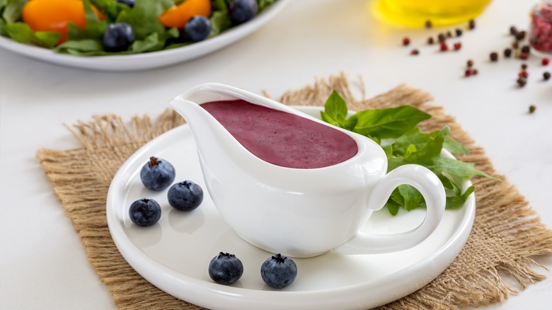 blueberry vinaigrette on plate with basil