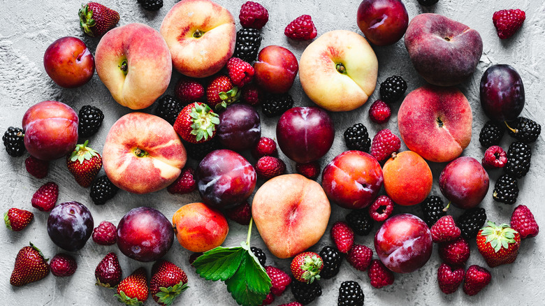 variety of fruits on counter with mint