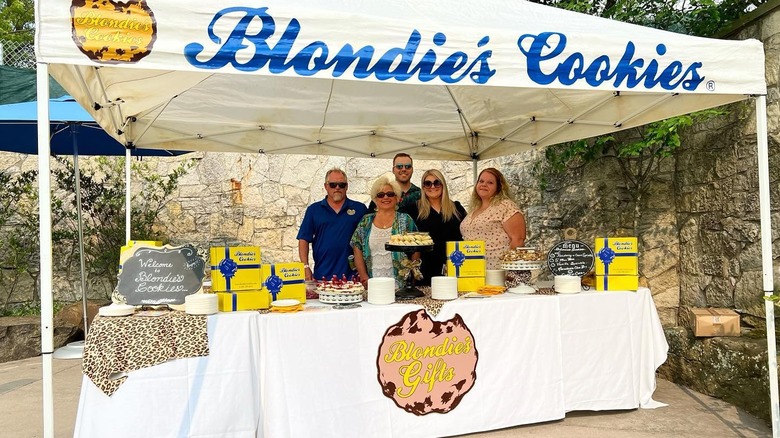 Blondie and others at a Blondie's Cookies stand in the zoo