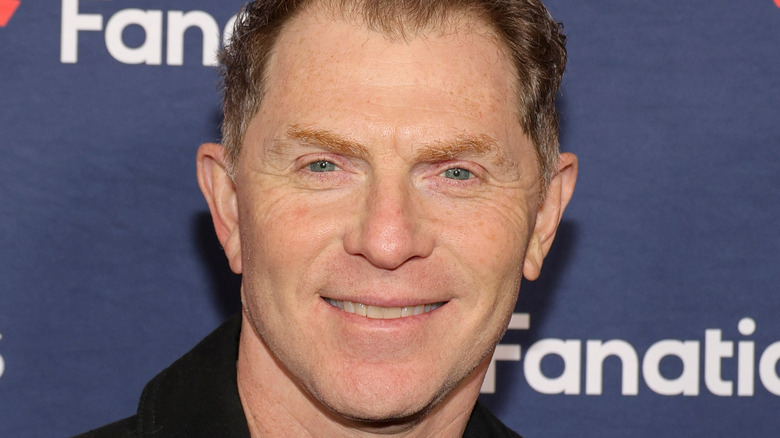 Bobby Flay smiling at event