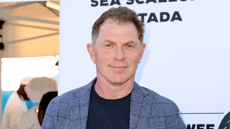 Bobby Flay smiling at an event