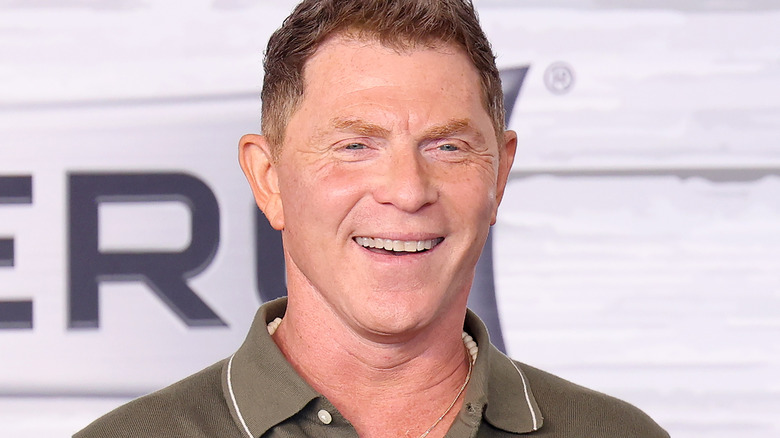 Bobby Flay smiling at a 2024 event