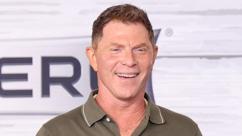bobby flay smiling at the south beach food and wine festibal