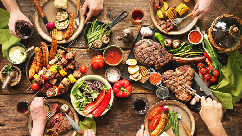 plates and bowls of food at a cookout
