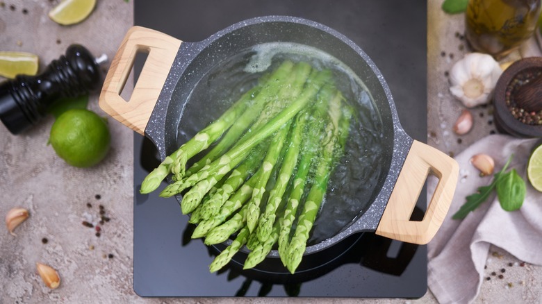 Boiling asparagus in a pot of water