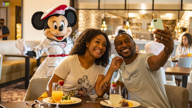 Couple take selfie with Minnie Mouse