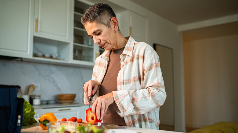 A boomer prepares food in the kitchen.