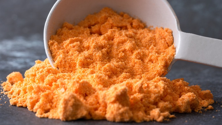 Cheddar powder spilling from cup