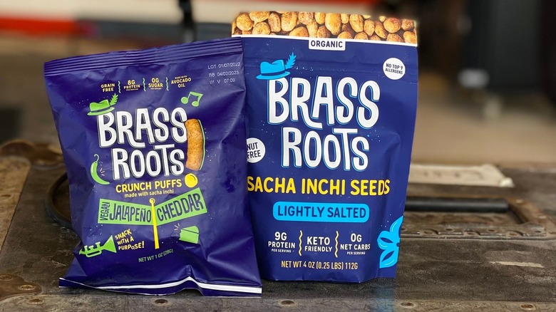 Bags of Brass Roots Puffs and roasted sacha inchi seeds