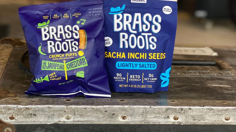 Bags of Brass Roots Puffs and roasted sacha inchi seeds