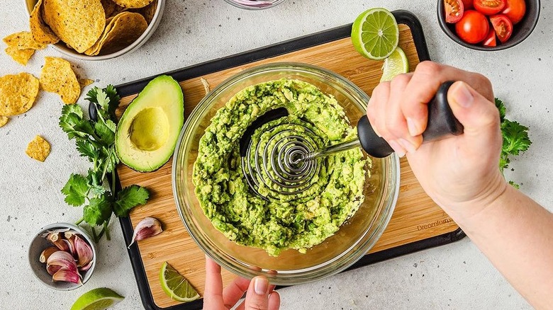 Potato masher in avocado