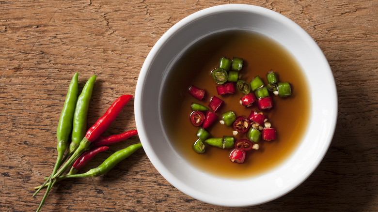Bowl of caramel-colored fish sauce