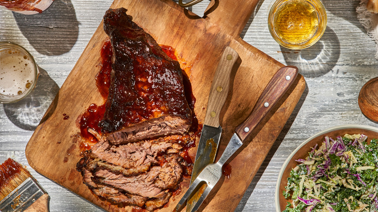 Sliced brisket on a cutting board.