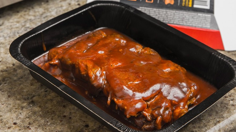 Bubba's Boneless Rib Steaks in black container