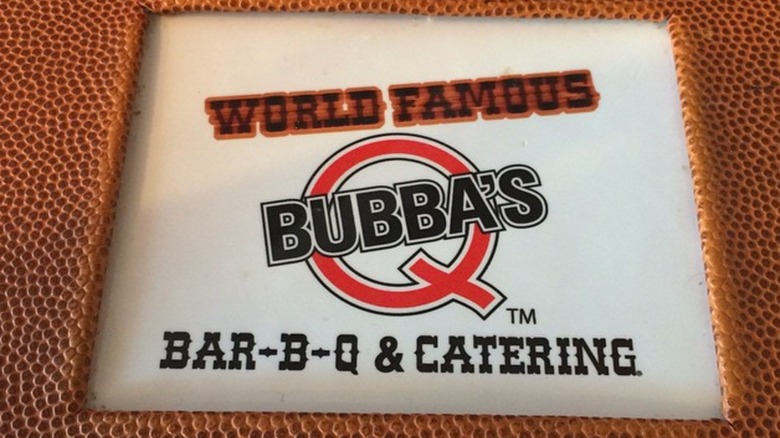 A close-up of the Bubba's Q menu, reading "World Famous Bubba's Q Bar-B-Q & Catering"