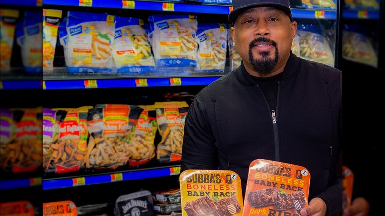 Daymond John in supermarket holding Bubba's Q