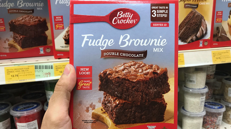 hand holding brownie box mix