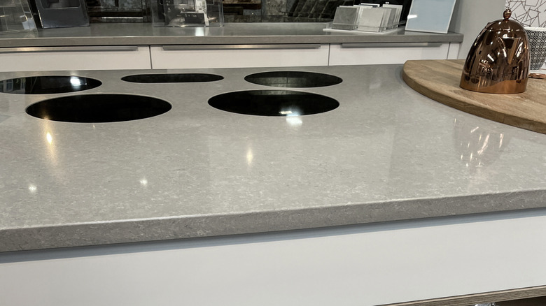A gray solid surface countertop in a modern kitchen.